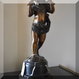 A19. Bronze cherub statue with roses. Signed ”E. Plat”. 19”h including marble stand.